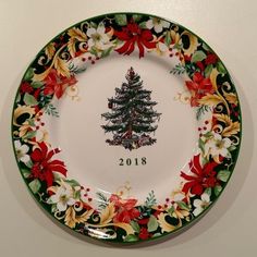 a decorative plate with a christmas tree on it