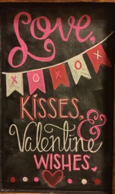 a chalkboard sign that says love kisses and valentine wishes