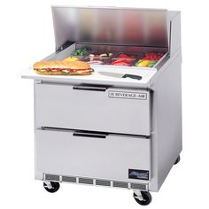 an image of a sandwich prep table with food on the top and two drawers underneath it