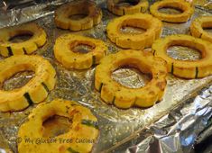 some food is sitting on top of tin foil and ready to be cooked in the oven