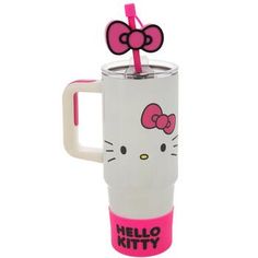 a hello kitty travel mug with a straw in it's mouth and a pink handle