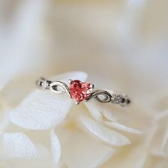 a close up of a ring with a heart on it