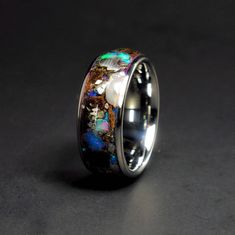 The Lunar Galaxy Rex™ Tyrannosaurus Rex Fossil/Bone, Lunar Meteorite NWA 5000, Nantan Meteorite, and Welo Opal with a Blue, Purple, and Pink Glow. This is really the ultimate wedding band and one of my personal favorites! RING INFORMATION Ring Name: Lunar Galaxy Rex™ Inlays: Tyrannosaurus Rex Fossil/Bone, NWA 5000 Lunar Meteorite, Nantan Meteorite, Welo Opal, Lab Opal Glow: Blue, Purple, and Pink Width: 4, 5, 6, 8, & 9 mm Sleeve: Tungsten Profile: Dome Finish: Polished Fit: Comfort Fit THE MATER Bone Wedding Ring, Lunar Meteorite, Rough Diamond Engagement Ring, Glow Ring, Tooth Ring, Meteorite Wedding Band, Fossil Bones, Meteorite Ring, Day Glow