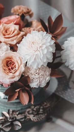 a vase filled with flowers on top of a table