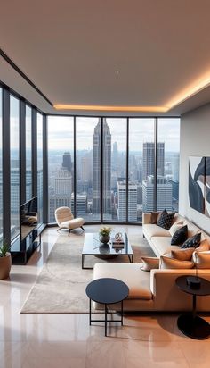 a living room filled with furniture and tall windows