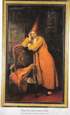 an oil painting of a woman dressed as a wizard leaning on a chair with her hand to her face