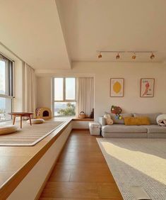 a living room with wood floors and white walls