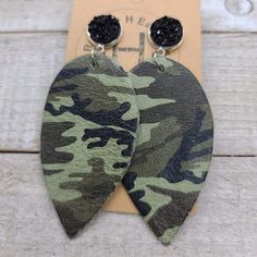 two pairs of camouflage leather earrings with black beading on the front and back of them