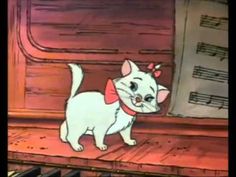 a white cat standing on top of a wooden piano next to musical notes and sheet music