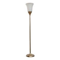 a gold floor lamp with a white glass shade