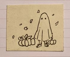 a drawing of a ghost with pumpkins on a piece of paper that has been drawn