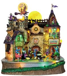 a small toy house with lots of decorations on it