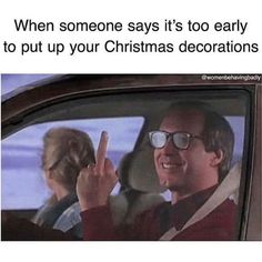 a man and woman sitting in a car with the caption when someone says it's too early to put up your christmas decorations