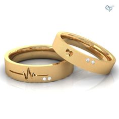 two rose gold wedding bands with hearts and heartbeats on each band, set against a white background