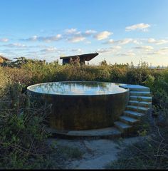 there is a large round pool in the middle of nowhere