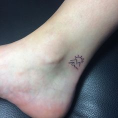 a person with a small tattoo on their foot