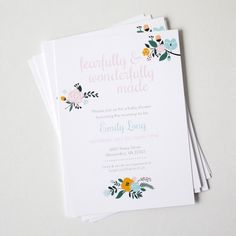 three wedding cards with flowers on them sitting next to each other and the words, happily & wonderfully made