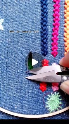 someone is using scissors to cut through the holes in their jean pants with crochet