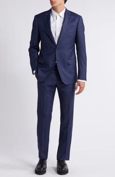 Classic and smart, this wool suit styled in a dark-blue mélange features traditional detailing that makes it a versatile addition to any formal wardrobe. Jacket has notched lapels; chest welt pocket; flap pockets; side vents Trousers have zip fly; slant pockets; back button-welt pockets Jacket is lined; trousers are lined to the knee 100% virgin wool Dry clean Imported Blue Professional Three-piece Suit For Semi-formal Occasions, Tailored Blue Wool Suit, Tailored Blue Three-piece Suit For Formal Occasions, Formal Blue Three-piece Suit, Blue Three-piece Suit For Formal Occasions, Blue Professional Three-piece Suit For Formal Occasions, Blue Business Suit With Notch Lapel, Formal Blue Wool Suits, Blue Notch Lapel Three-piece Suit For Formal Occasion