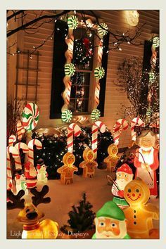 an outdoor christmas scene with candy canes and decorations