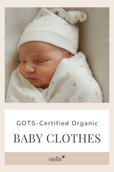 a baby wrapped in a blanket with the words gots - certified organic baby clothes