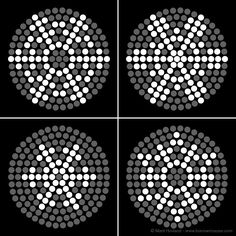 four circles with white dots in the middle