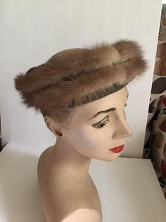 "Vintage 1950's 1960's Mink and Velvet Ringlet hat. Has a Satin bow in the back. No makers label or tag. Open crown style hat. *MORE INFORMATION BELOW* CONDITION: No issues noted. MEASURES: Inside circumference~21\" Height~2 1/2\" Front to back~8\" Left to right~7\" *WE APOLOGIZE~BUT WE NO LONGER SHIP TO GERMANY, ITALY OR SPAIN. IF ORDERS COME IN FROM GERMANY, ITALY OR SPAIN, WE WILL HAVE TO CANCEL THEM AND REFUND YOUR MONEY. SORRY FOR THIS INCONVENIENCE*" Vintage Adjustable Fascinator Headband, Vintage Adjustable Hat Bands, Vintage Mini Hat Headband For Vintage Events, Vintage Evening Fascinator Headband, Vintage Evening Headband Headpiece, Vintage Headband Headpiece For Evening, Vintage Headband Style Headpiece For Evening, Vintage Formal Headband Costume Hat, Vintage Headband For Formal Occasions