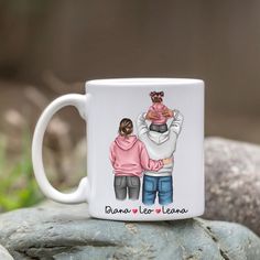 a white coffee mug with an image of two people holding each other