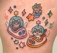 an image of two cats in a space ship tattoo