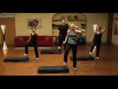 a group of people in a room doing yoga