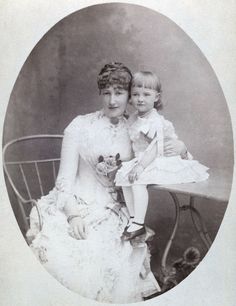 an old photo of two women and a baby