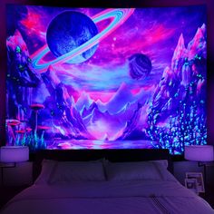 a bed with a painting on the wall above it in a room that is lit up