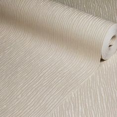 a roll of white fabric on top of a table