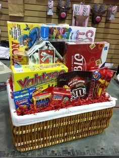 a wicker basket filled with candy, snacks and candies on top of a table