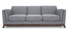 a grey couch with wooden legs on a white background