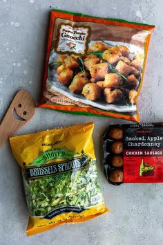 some food is laying out on the ground next to a bag of broccoli