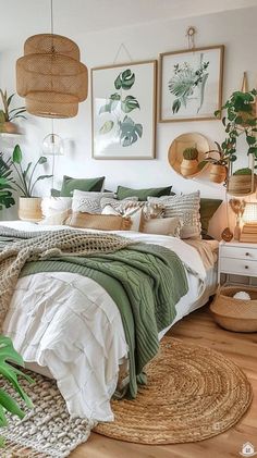 a bedroom with lots of plants and pictures on the wall above the bed, along with wicker baskets hanging from the ceiling