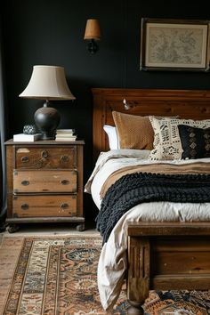 a bedroom with black walls and wooden furniture