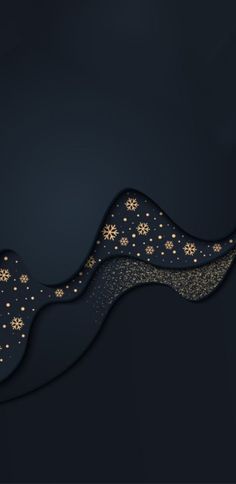 a black background with gold snowflakes and stars in the dark blue sky above it