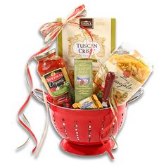 a red colander filled with condiments and snacks