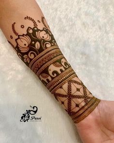 the arm is decorated with an intricate pattern