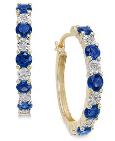 Invite enchantment with these glamorous round-shape sapphire and diamond hoop earrings set in 14k gold. Also available in emerald or ruby. Approximate diameter: 3/4".