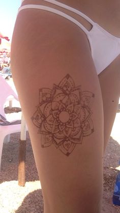 a woman with a tattoo on her thigh