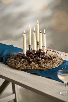 a tray with candles on it sitting on a table