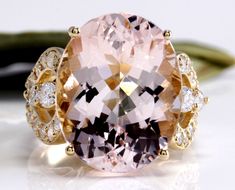 12.00 Carats Exquisite Natural Morganite and Diamond 14K Solid Yellow Gold Ring Suggested Replacement Value: $7,900.00 Total Natural Oval Shaped Morganite Weights: Approx. 11.00 Carats Morganite Measures: Approx. 16.00 x 12.00mm Natural Round Diamonds Weight: Approx. 1.00 Carats (color G-H / Clarity SI1-SI2) Ring total weight: Approx. 10.0 grams Disclaimer: all weights, measurements and colors are approximate and may vary slightly from the listed dimensions or as seen in the image. All pictures Luxury Round Cut Morganite Jewelry, Pink Round Morganite Jewelry, Luxury Multi-stone Morganite Jewelry, Exquisite Pink Morganite Ring, Luxury Morganite Multi-stone Jewelry, Emerald Cut Aquamarine Ring, Emerald Cut Rings, Etsy Gold Ring, Morganite