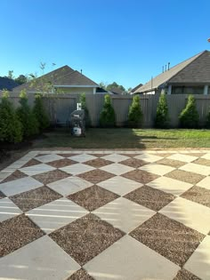 a large checkerboard pattern is in the yard