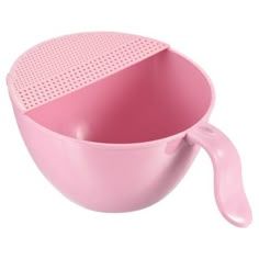 a pink bowl with a spoon in it