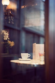 a coffee cup sitting on top of a table