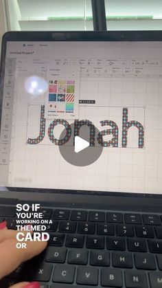 a person is using a laptop computer with the word jon on it and an image of a keyboard