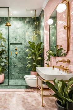 a bathroom with pink and green tiles, gold fixtures and plants in the shower area